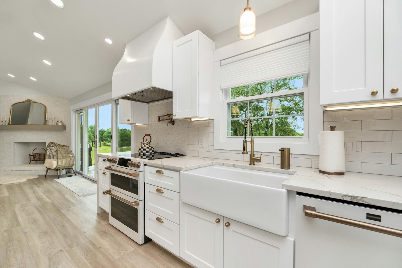 Bright white kitchen with daylight and white cabinets